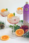 Festive Christmas VnC Passionfruit Daiquiri Cocktail served with orange, mint and pomegranate 